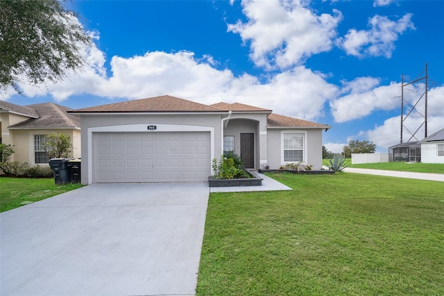 view of front of property with a garage and a front lawn