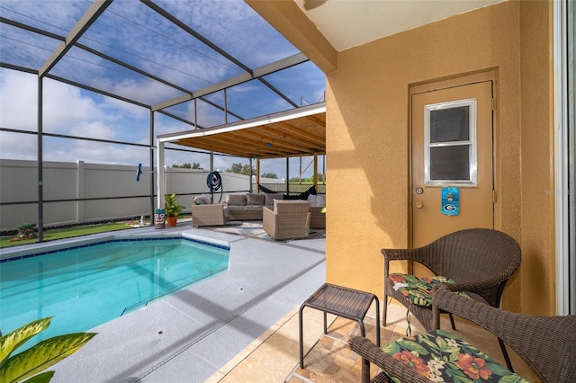 view of pool with a lanai, an outdoor living space, and a patio area