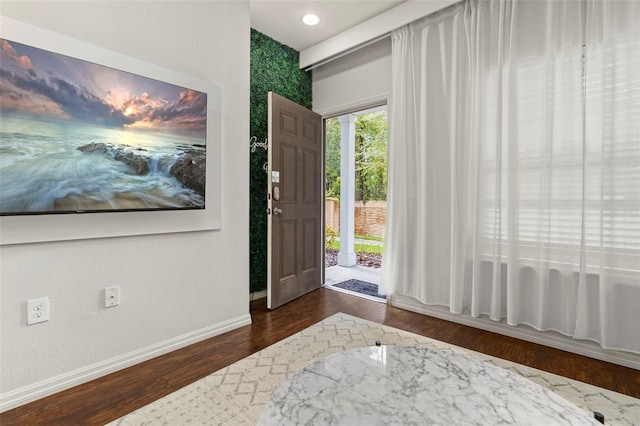 8968 Silver Pl, Kissimmee, FL 34747 - foyer entrance with baseboards and wood finished floors