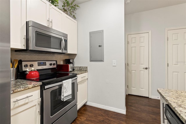 8968 Silver Pl, Kissimmee, FL 34747 - kitchen featuring stainless steel appliances, backsplash, dark wood-style flooring, electric panel, and baseboards