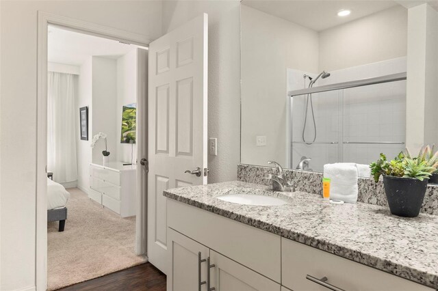 8968 Silver Pl, Kissimmee, FL 34747 - full bathroom with a shower stall, vanity, wood finished floors, and recessed lighting