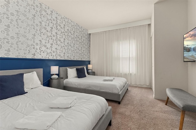 8968 Silver Pl, Kissimmee, FL 34747 - carpeted bedroom featuring wallpapered walls and a wainscoted wall