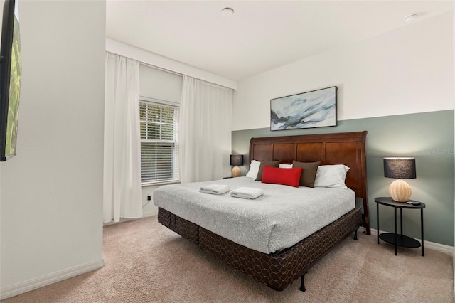 bedroom with light colored carpet