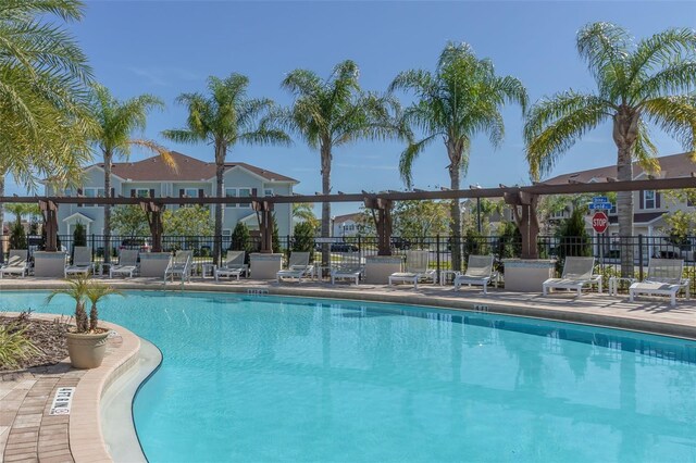 8968 Silver Pl, Kissimmee, FL 34747 - community pool with fence and a patio area