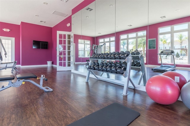 gym featuring dark hardwood / wood-style flooring