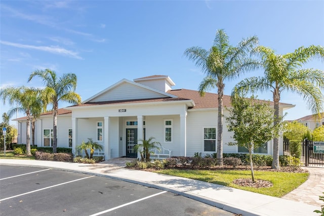 8968 Silver Pl, Kissimmee, FL 34747 - view of property featuring uncovered parking and fence