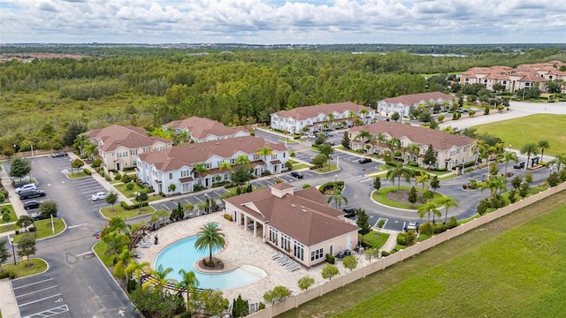 8968 Silver Pl, Kissimmee, FL 34747 - aerial perspective of suburban area with a forest and a pool area