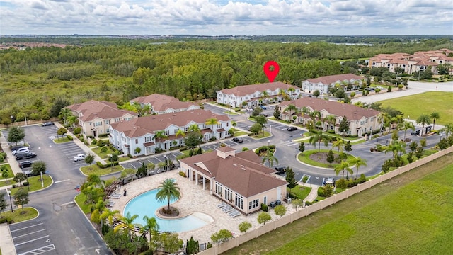 8968 Silver Pl, Kissimmee, FL 34747 - aerial perspective of suburban area with a forest and a pool area