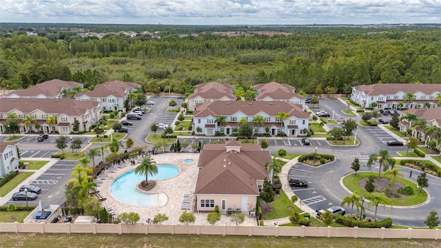 8968 Silver Pl, Kissimmee, FL 34747 - aerial perspective of suburban area featuring a heavily wooded area and a pool