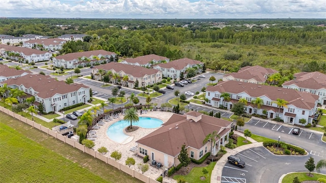 8968 Silver Pl, Kissimmee, FL 34747 - drone / aerial view of a pool area and a heavily wooded area