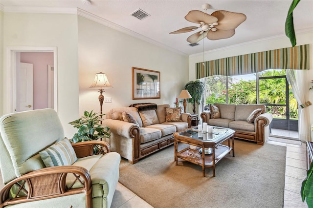 living room with ceiling fan, ornamental molding, and light tile patterned floors