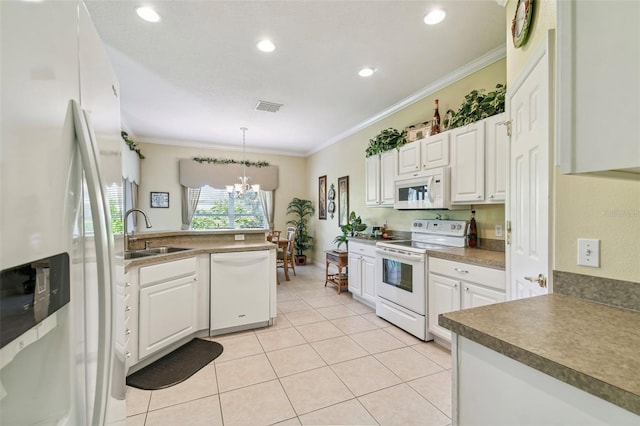 kitchen featuring an inviting chandelier, white appliances, pendant lighting, ornamental molding, and sink