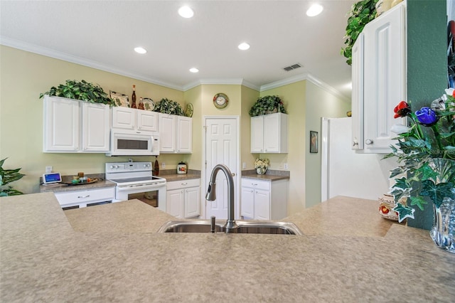 kitchen featuring white cabinets, white appliances, crown molding, and sink