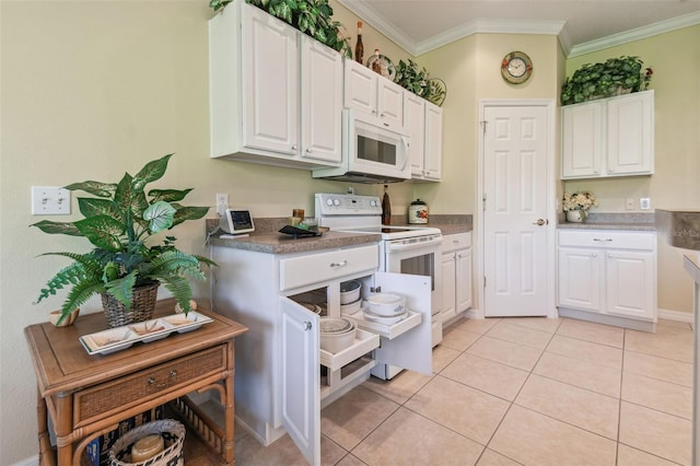 kitchen with ornamental molding, light tile patterned floors, white appliances, and white cabinetry