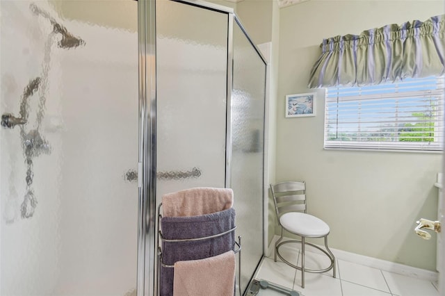 bathroom featuring an enclosed shower and tile patterned floors