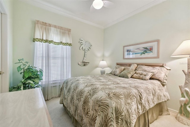 bedroom featuring crown molding, light colored carpet, and ceiling fan