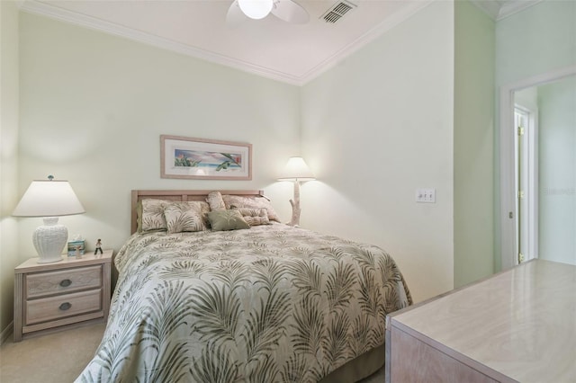 bedroom featuring crown molding, light colored carpet, and ceiling fan