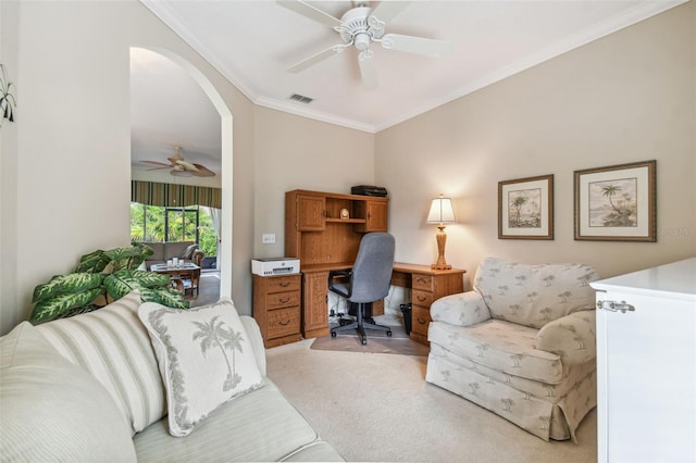 carpeted office space featuring crown molding and ceiling fan