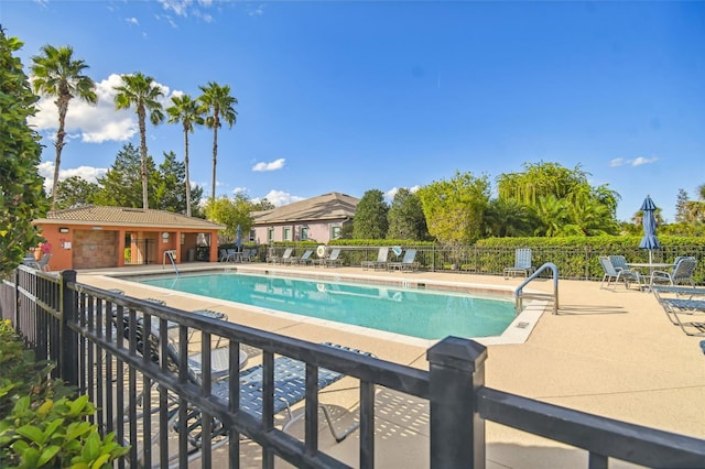 view of swimming pool featuring a patio area