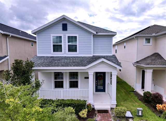 front of property with a front lawn and covered porch