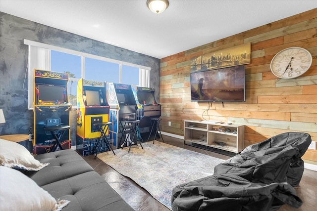 living room featuring wooden walls and dark wood-type flooring