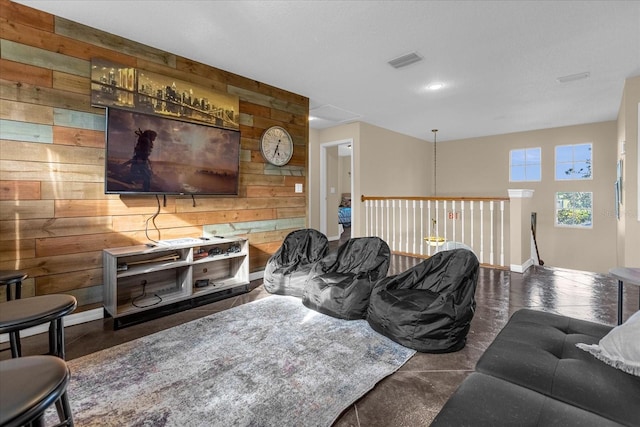 living room with wood walls