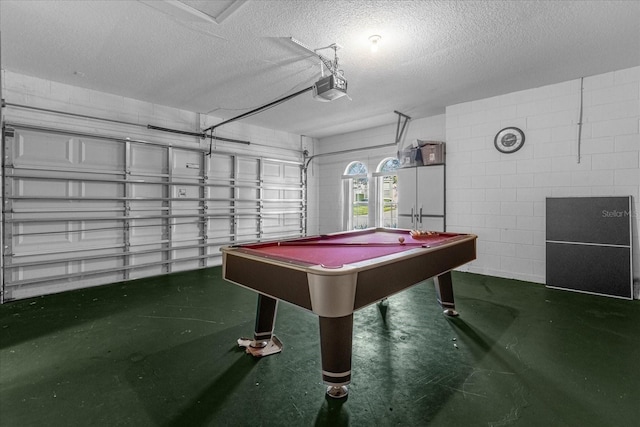 rec room featuring a textured ceiling and pool table