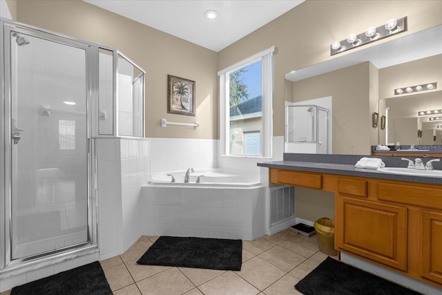 bathroom with vanity, tile patterned floors, and independent shower and bath