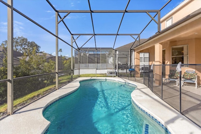 view of pool with a lanai and a patio area