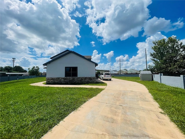 view of side of home featuring a yard