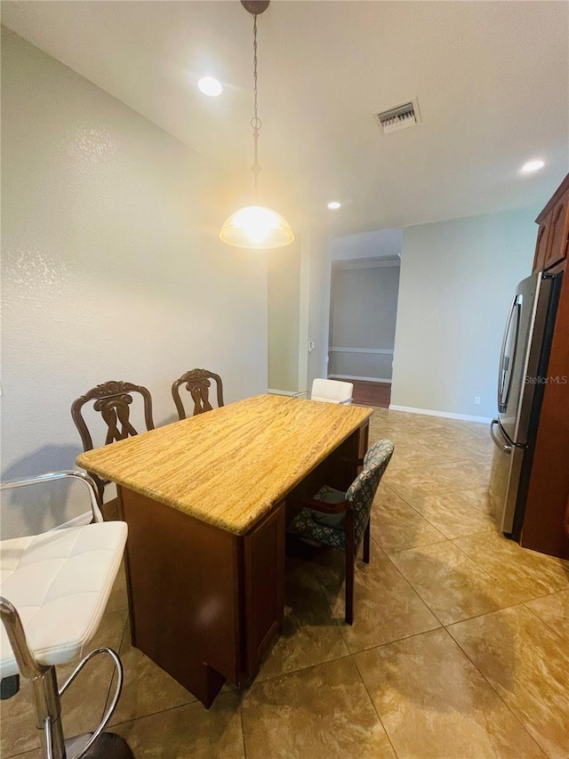 dining area with tile patterned floors