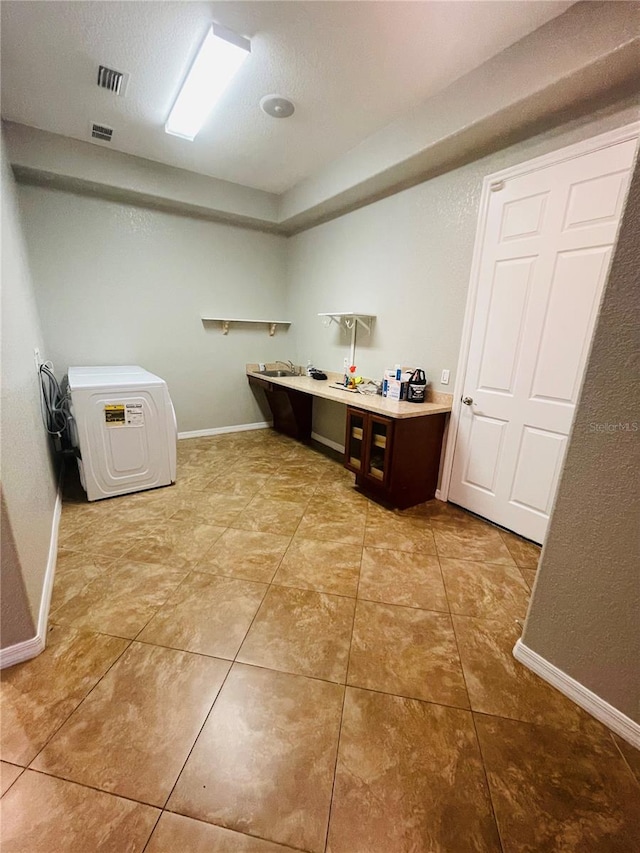 laundry room with tile patterned floors