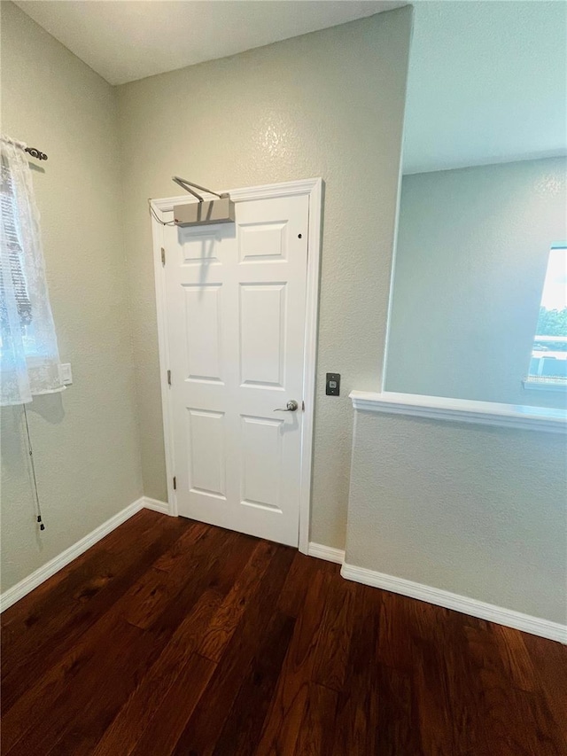 foyer entrance with dark wood-type flooring