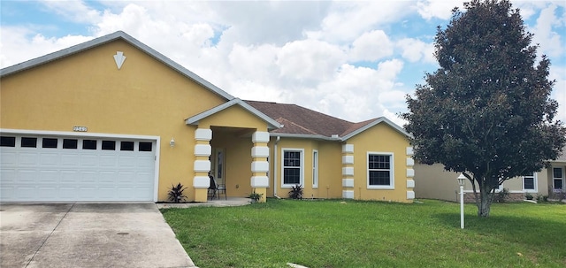 ranch-style house with a garage and a front lawn