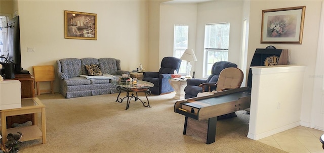 living area featuring tile patterned flooring and carpet flooring