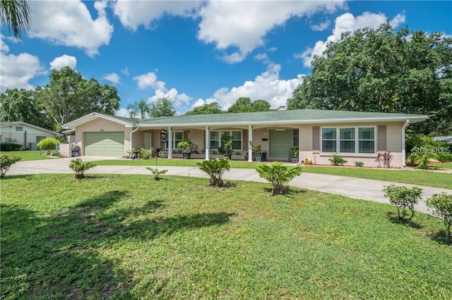 ranch-style home with a garage, a porch, and a front yard