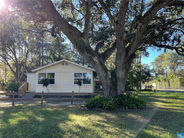 view of property exterior with a yard