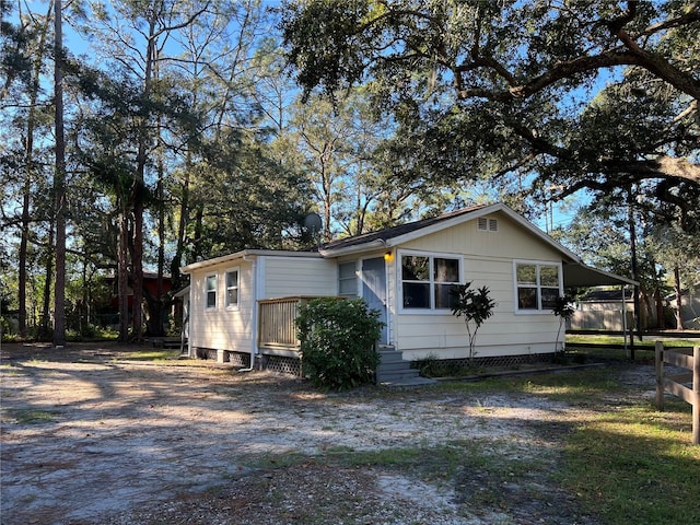 6790 Bass Hwy, Saint Cloud, FL 34771 - view of home's exterior featuring an attached carport