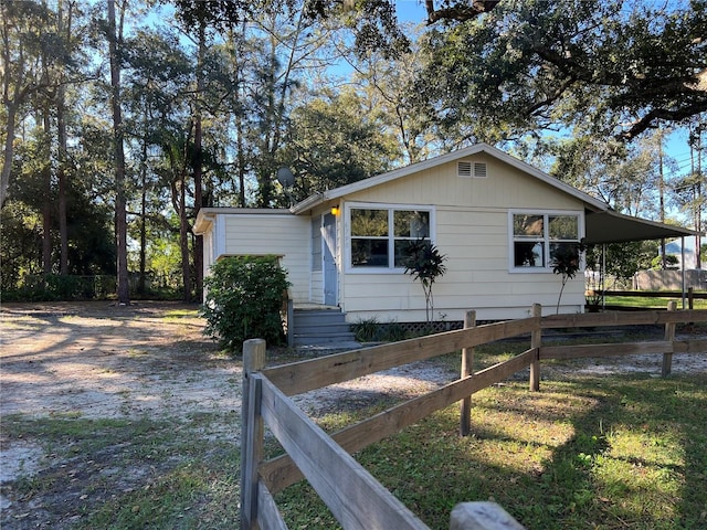 view of property exterior with a carport