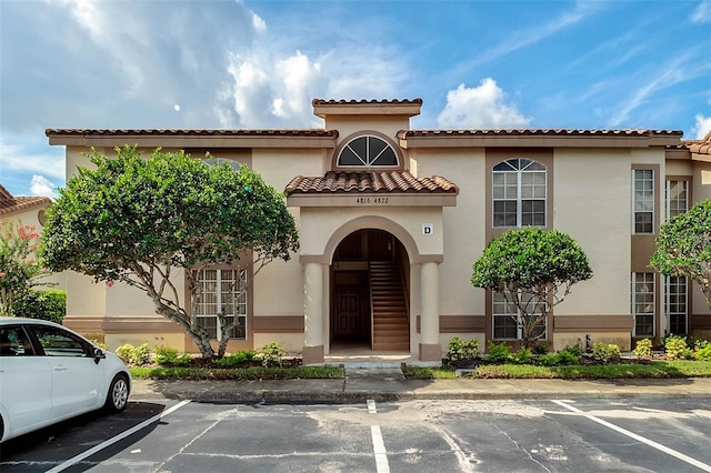 view of building exterior featuring uncovered parking