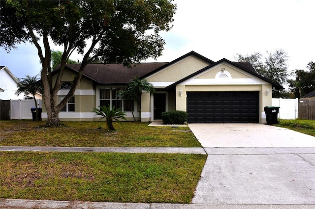 single story home featuring a garage and a front lawn