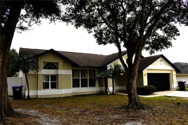 ranch-style house featuring a garage