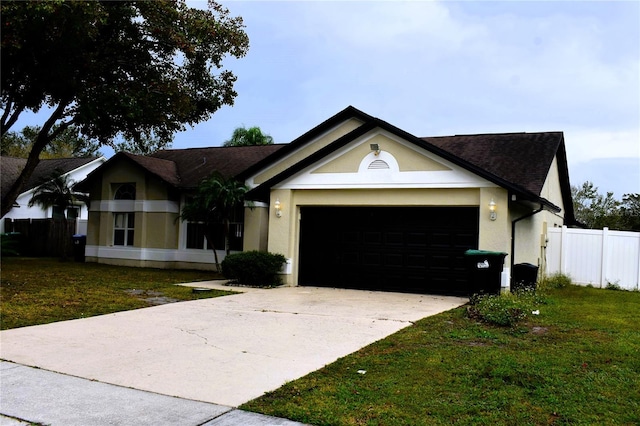 single story home with a garage and a front yard