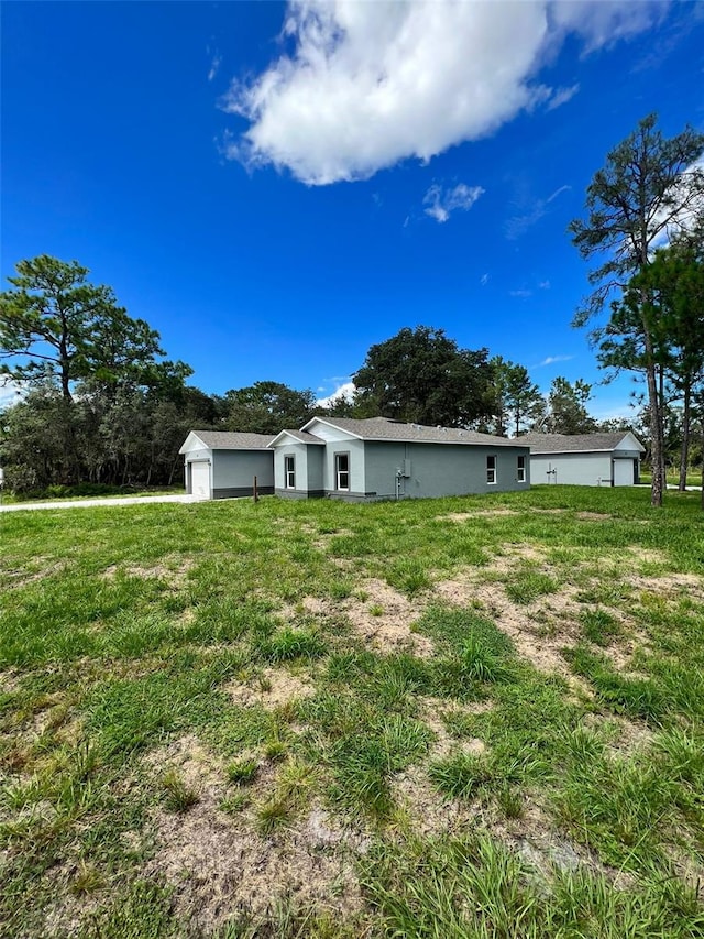 back of house with a garage