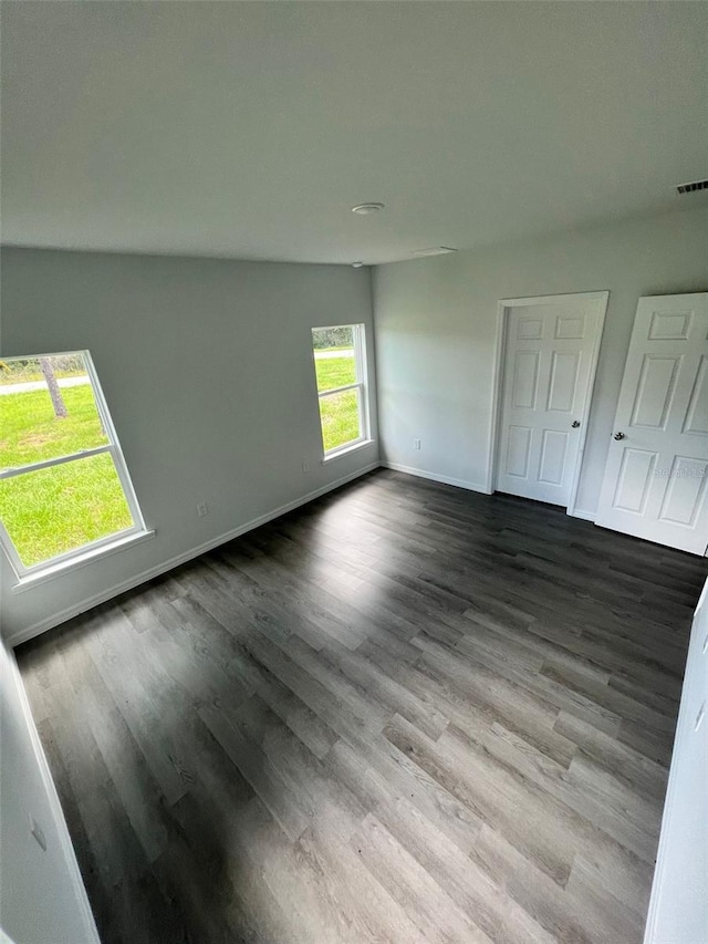 unfurnished bedroom featuring hardwood / wood-style flooring