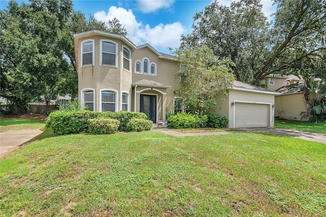 view of front of house featuring a garage and a front lawn