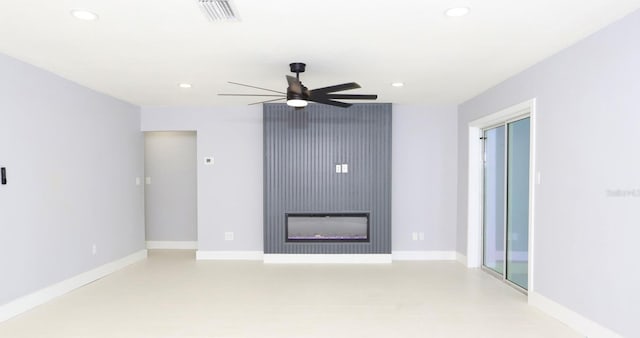 unfurnished living room featuring ceiling fan