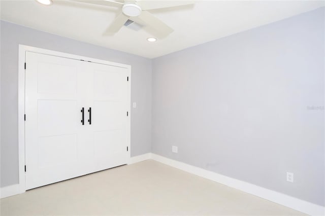 unfurnished room with ceiling fan