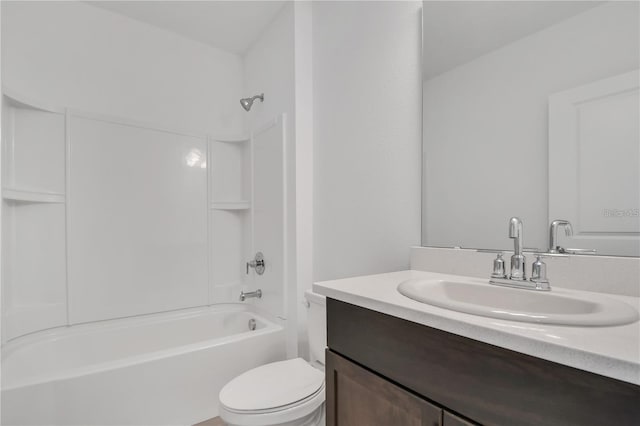 full bathroom with vanity, tub / shower combination, and toilet