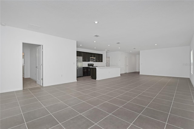 unfurnished living room with tile patterned floors